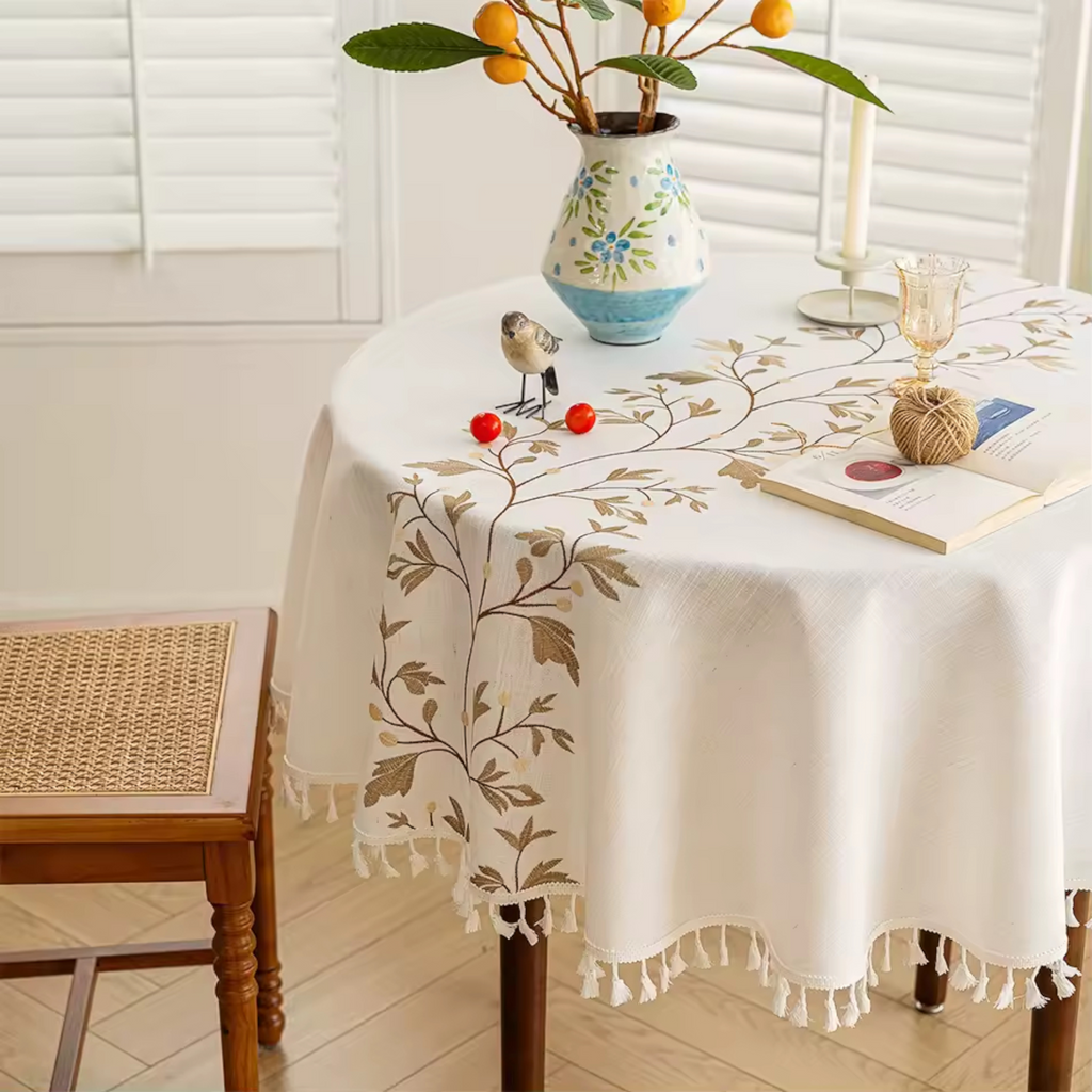 Artisan Botanical: Premium Round Embroidered Tablecloth | Elegant Tassel Edge Stoneware Companion